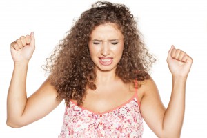 nervous and angry girl with curly hair