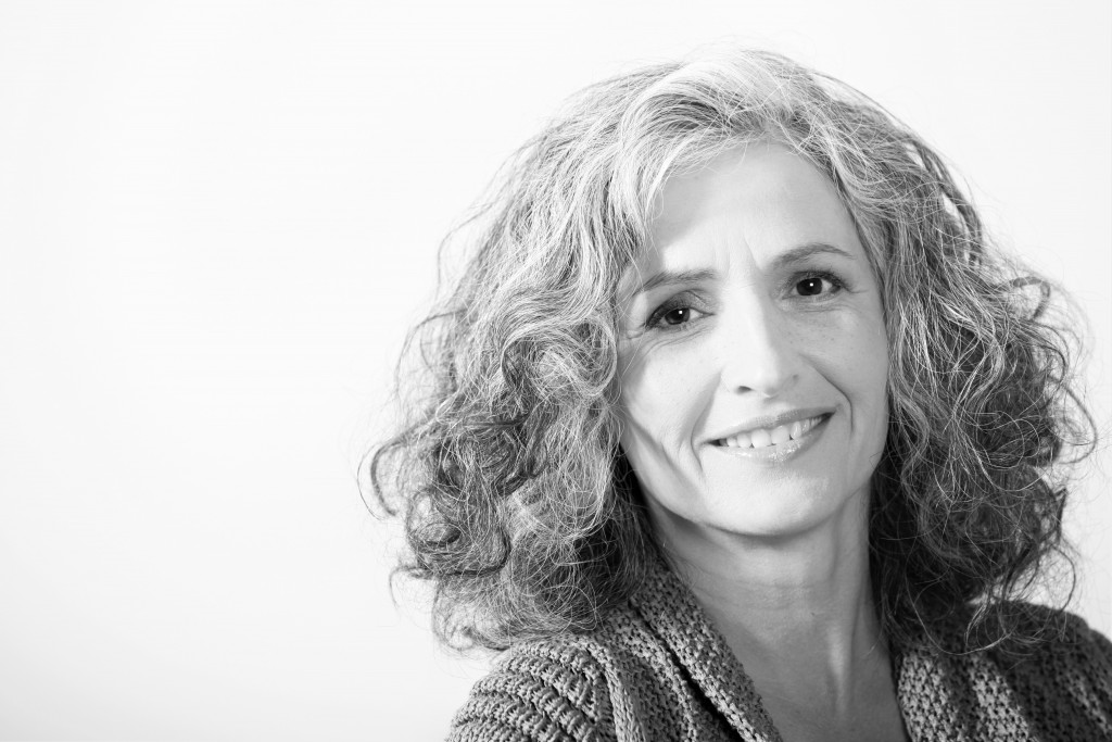 Grey-haired woman on white background