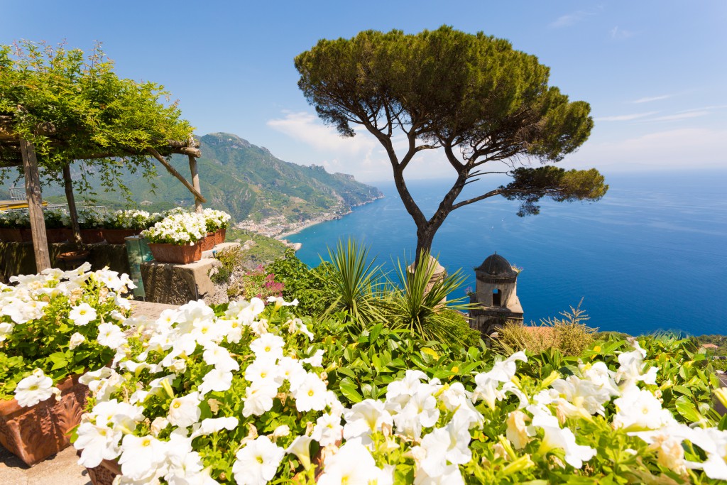 Ravello, Amalfi Coast, Salerno, Italy. Blue sky and sea with white flowers