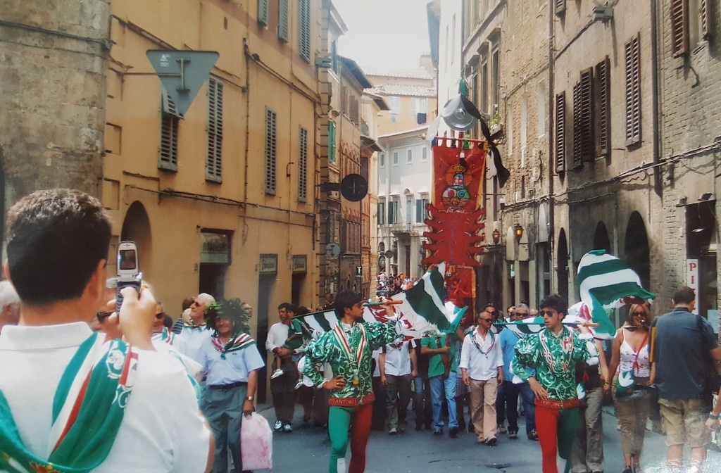 The winning quarter celebrate their victory in Siena's Palio Journey Time from Florence: 1h 30mins train; 40 mins by car